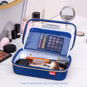 Blue makeup case with cosmetic items on a white surface