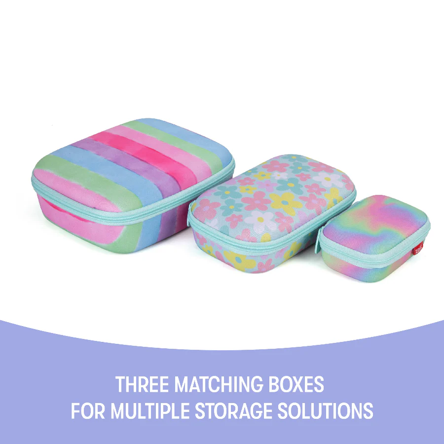 Three matching storage boxes with colorful patterns on a white background