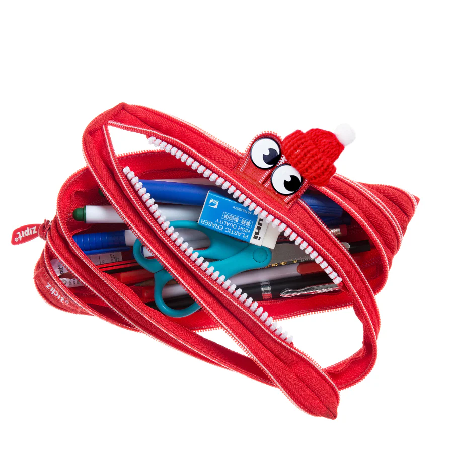 Red zipper pouch with stationery items on a white background