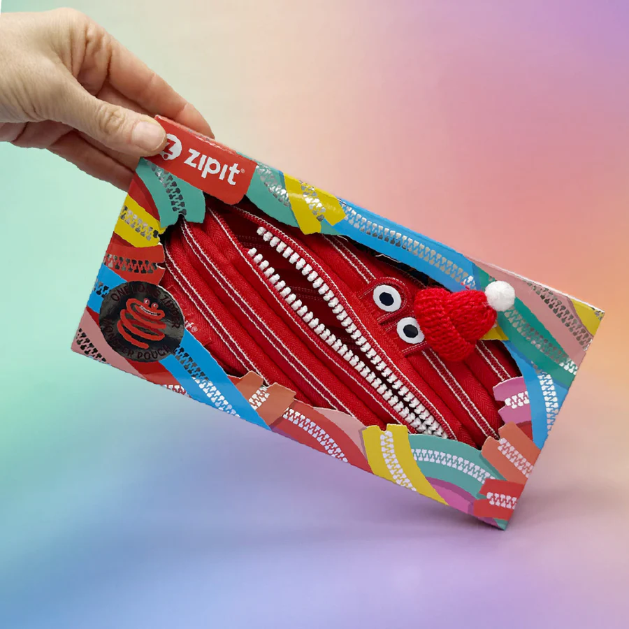 Colorful zipit pouch with a red zipper design held by a hand against a gradient background