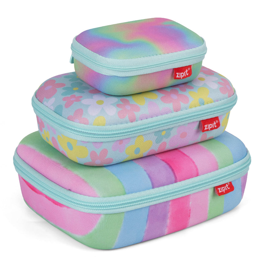 Three colorful zip-up storage cases with floral and striped patterns on a white background.