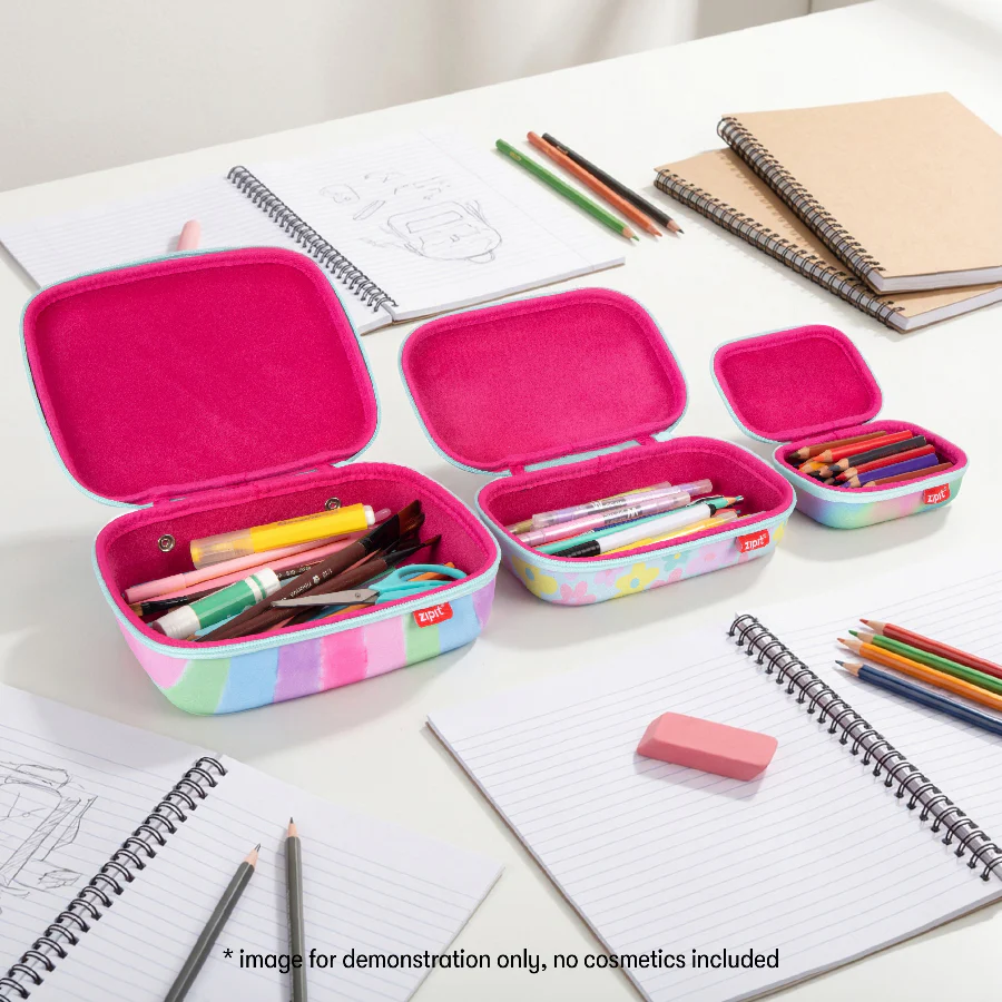 Pink pencil case with stationery items on a desk with notebooks and pencils.